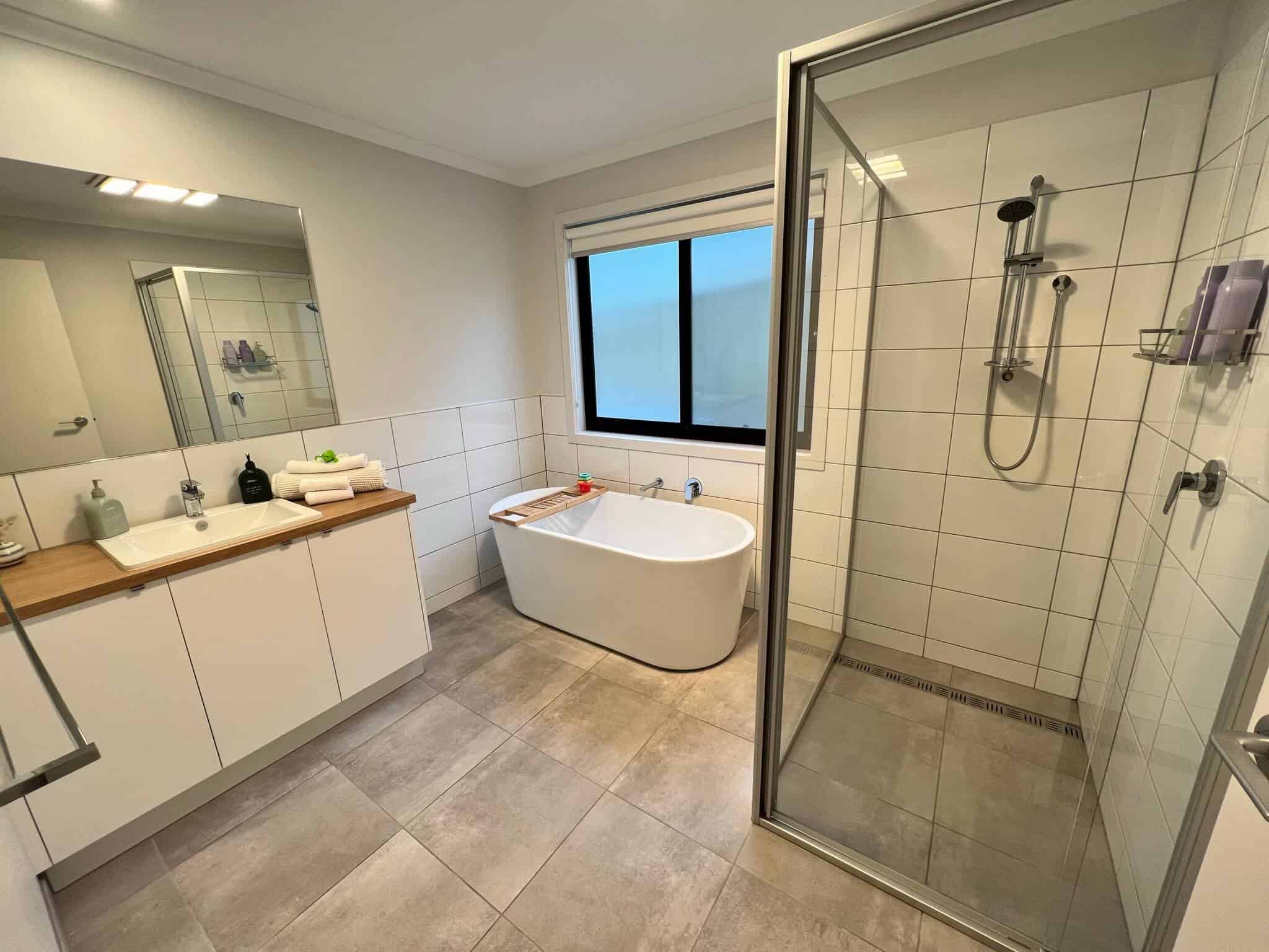 Bathroom with freestanding bath tub and shower